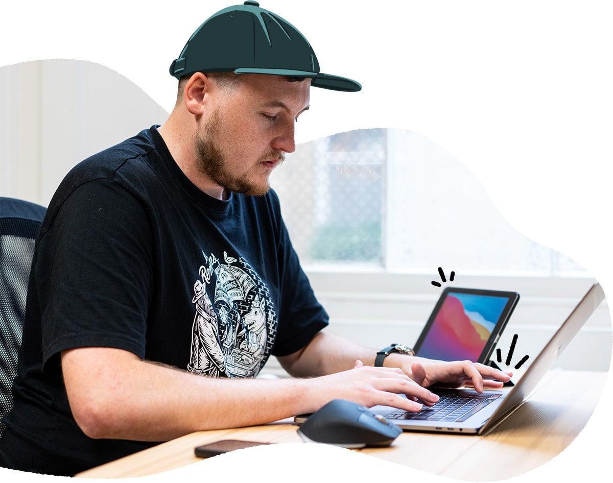Alex designing with laptop