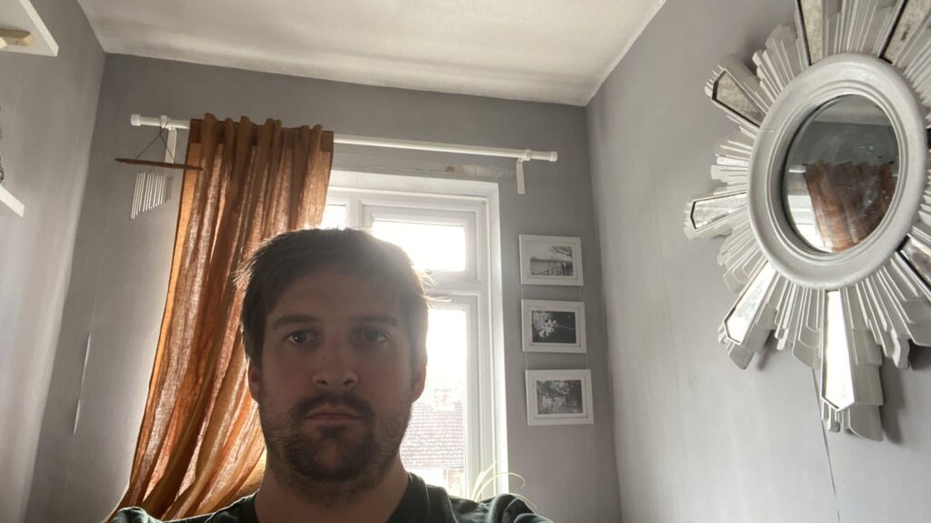 Hamish stood in front of a window showing correct lighting setup to film yourself
