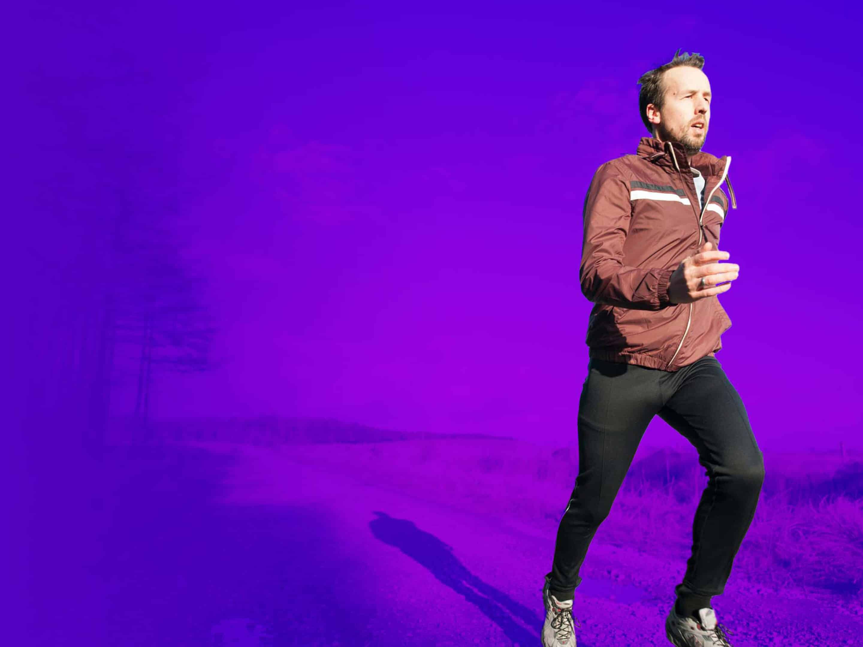 man running on purple background
