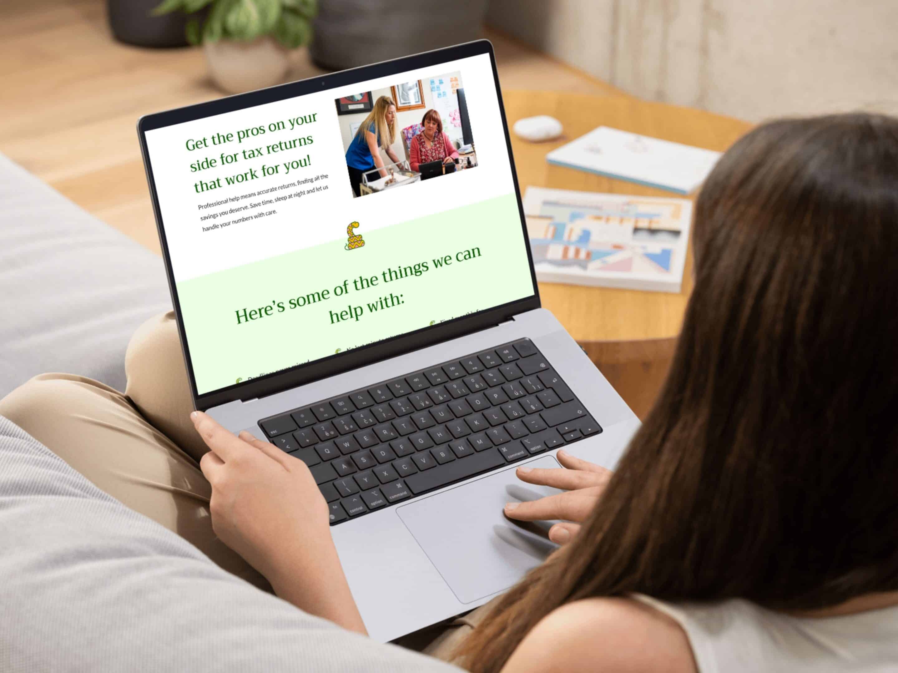 Person looking at Adder Bookkeeping Website on a laptop