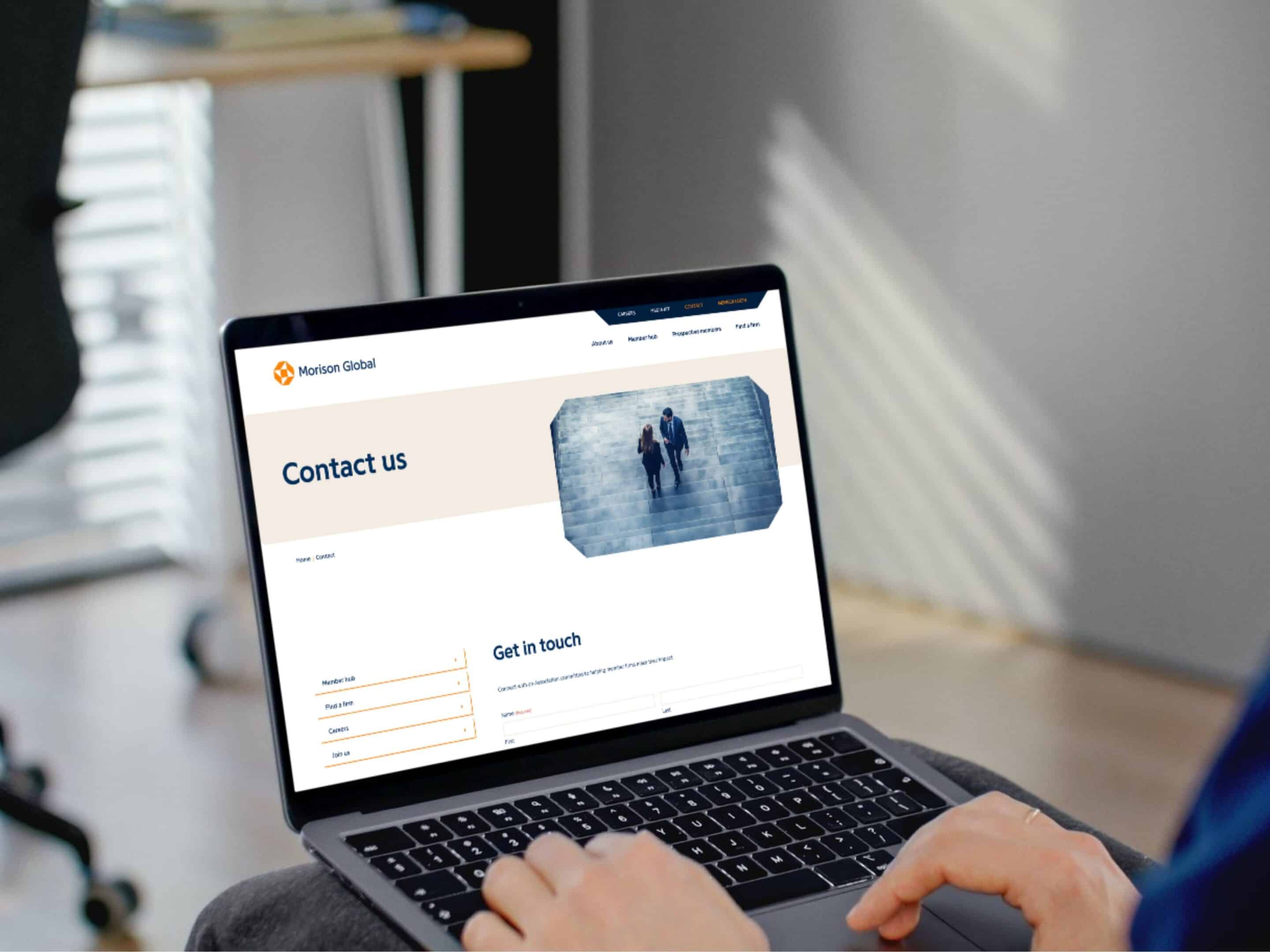 Morison Global contact page on a laptop