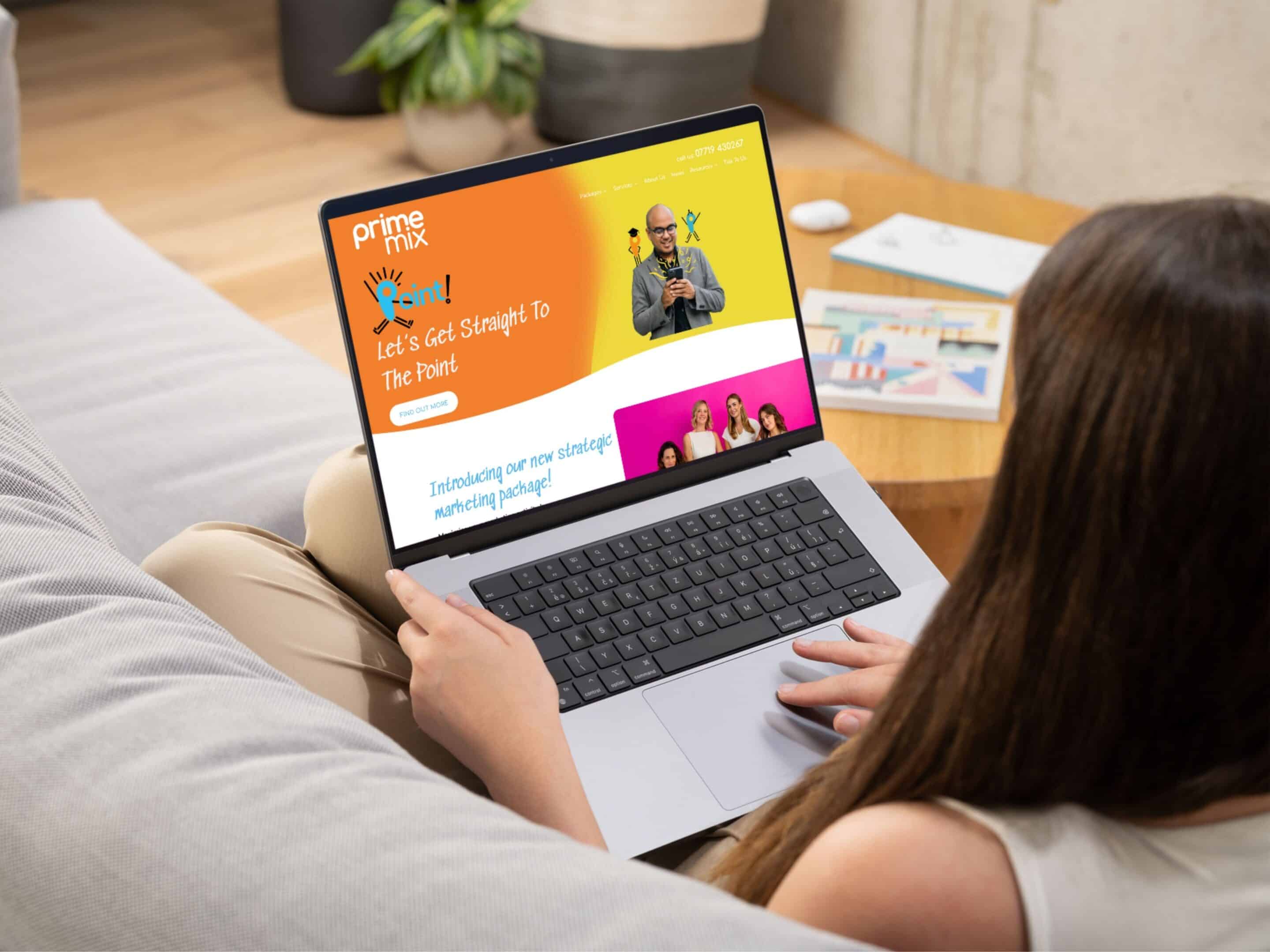Prime Mix website design on a laptop