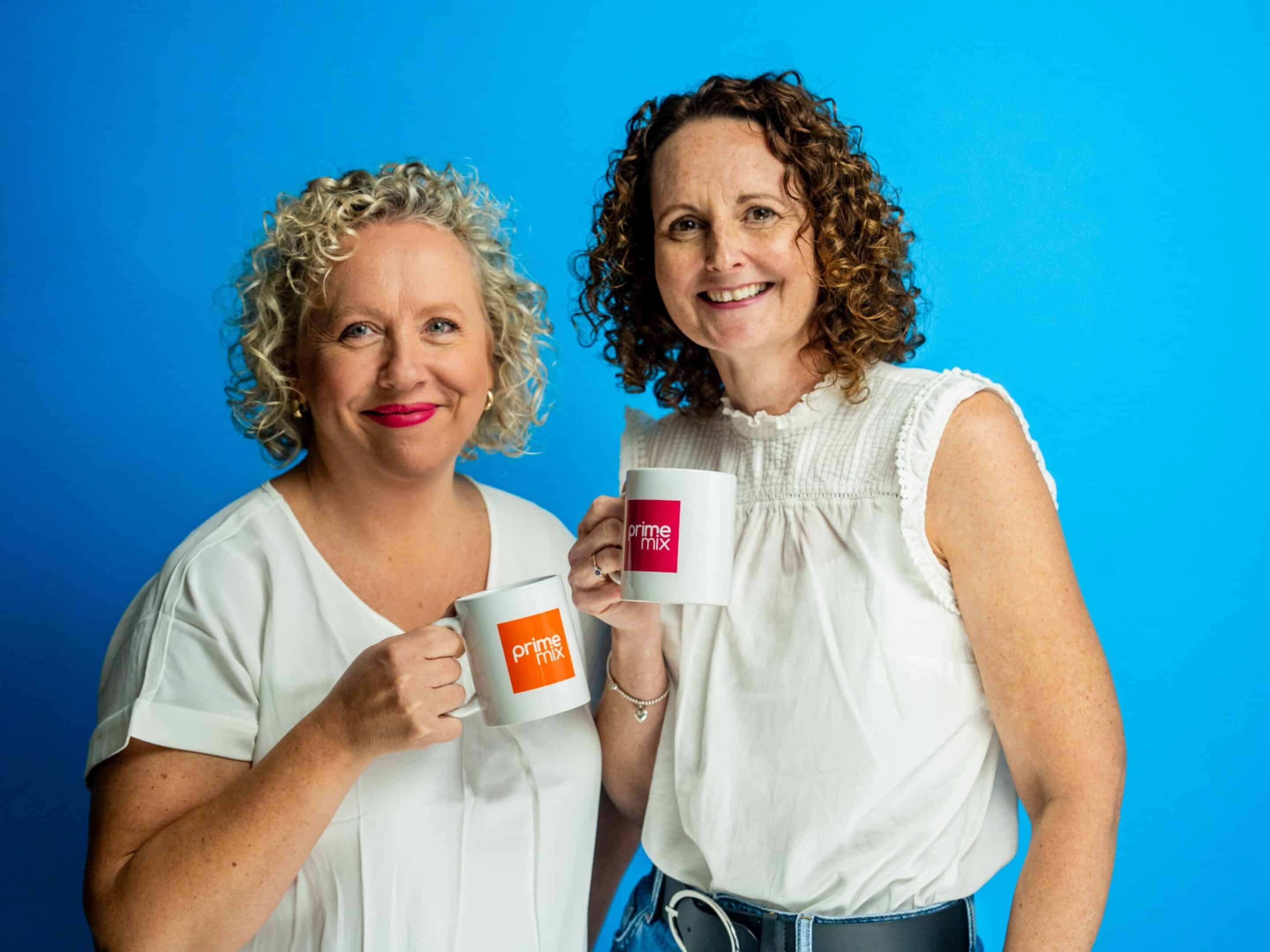 Prime mix branded photos holding branded mugs